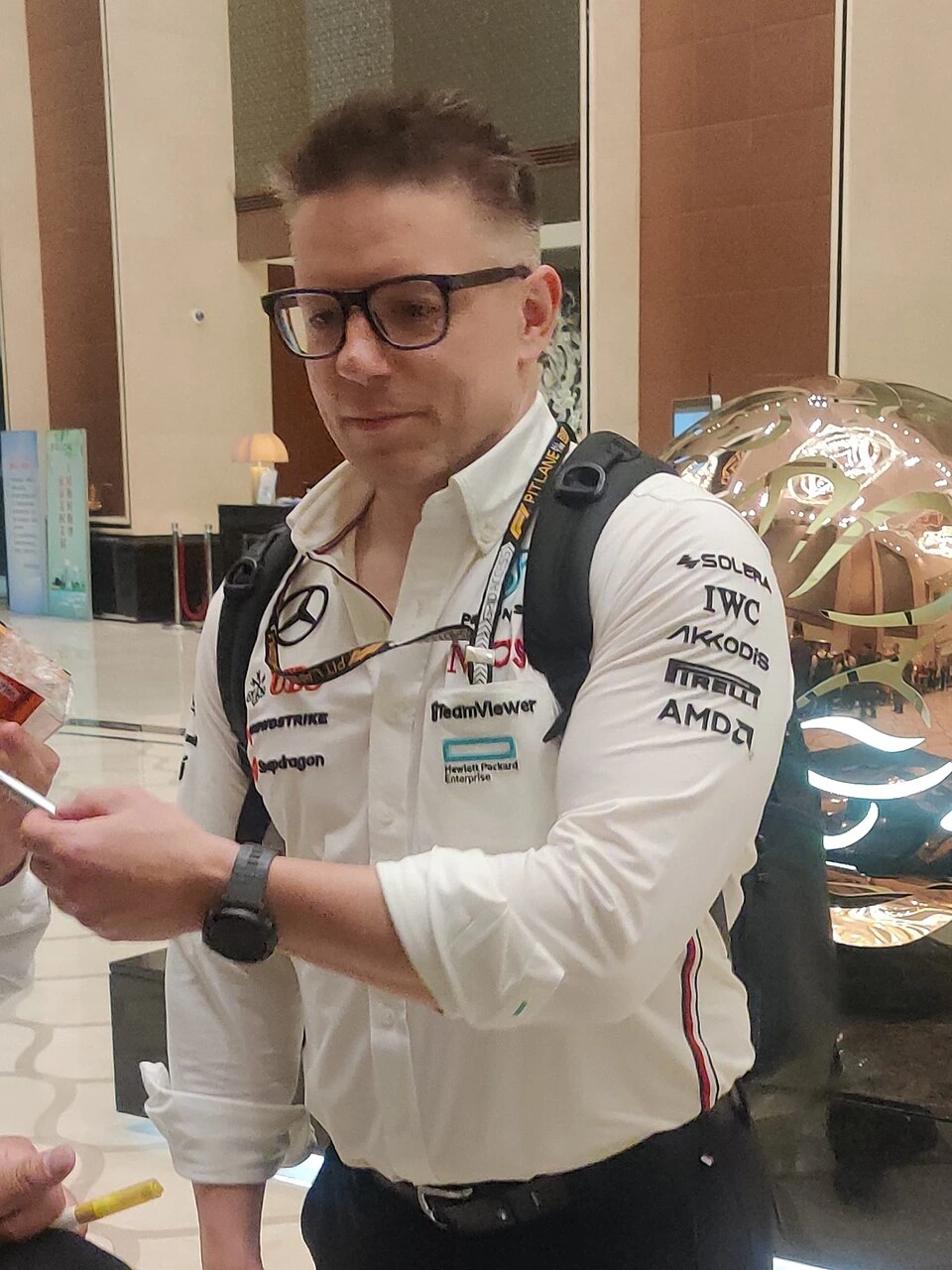 Peter Bonnington standing indoors in a Williams team shirt